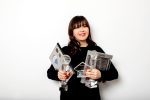 Leslie Brlec Top Etobicoke real estate agent holding awards.